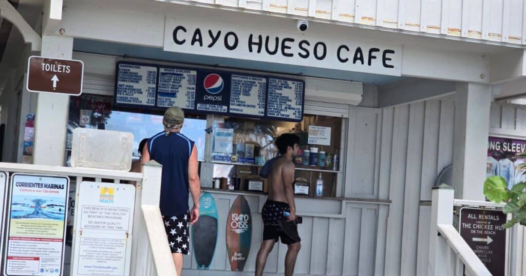 Beachside cafe at cayos hueso with tourists, tropical vacation, casual dining on the beach.