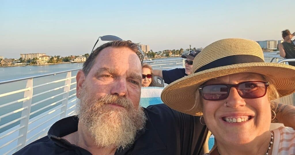 Beautiful couple enjoying a scenic boat cruise in Florida, perfect for outdoor adventure lovers and travel enthusiasts.