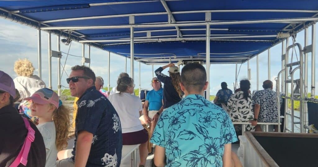 PEOPLE ON GLASS BOTTOM BOAT AT JOHN PENNEKAMP