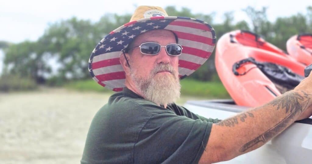 Outdoor adventures at John Pennekamp State Park Florida Keys MAN AT TRUCK UNLOADING KAYAKS